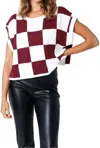 OLIVACEOUS CHECK IT TWICE SWEATER VEST IN CRIMSON