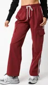 Olivaceous Track Pants In Burgundy In White