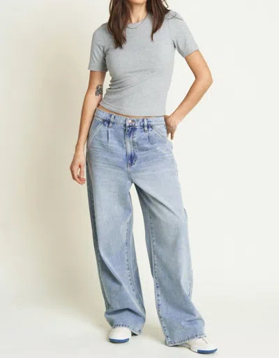 Oliver Logan Thompson Low Slung Wide Leg Denim Trousers In Light Indigo