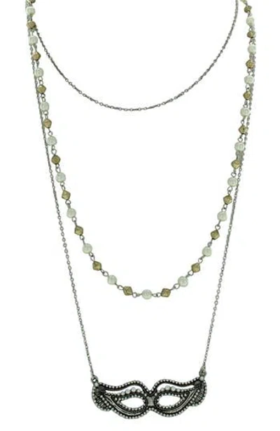 Olivia Welles Triple Layer Beaded Imitation Pearl Mask Pendant Necklace In Metallic