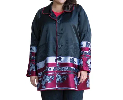 On The Plus Side Plus Size Reversible Raincoat In Black Poppy In Multi