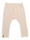 One More In The Family Beige Leggings In White