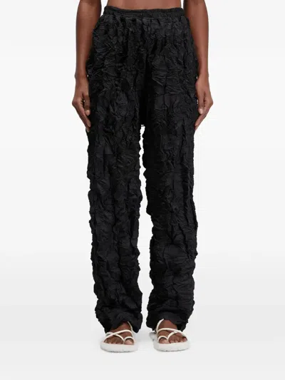 Osklen Plissé Texture Trousers In Black