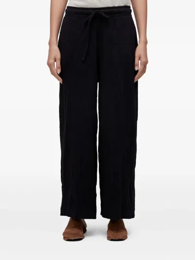 Osklen Wrinkle-effect Trousers In Black