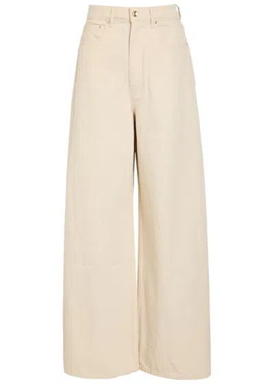 Ossou Slick Wide-leg Denim Jeans In Beige