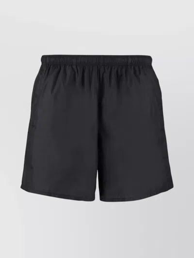 Our Legacy Elastic Waistband Swim Shorts With Side Pockets In Black