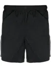 Our Legacy Elastic Waistband Swim Shorts With Side Pockets In Black