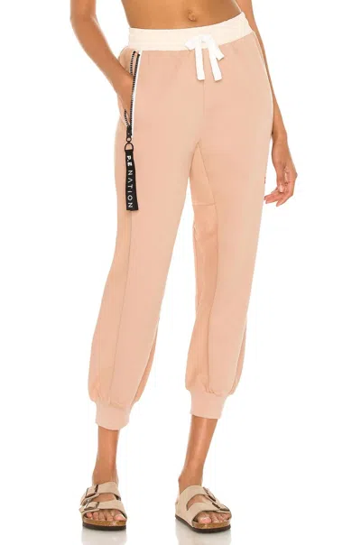 P.e Nation Regain Track Pant In Rugby Tan In Pink