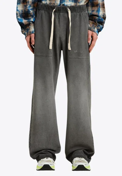 Palm Angels Dyed Travel Pants With Embroidered-logo In Black