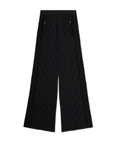 PALM ANGELS PALM ANGELS MONOGRAM-JACQUARD SIDE STRIPE DETAILED TROUSERS