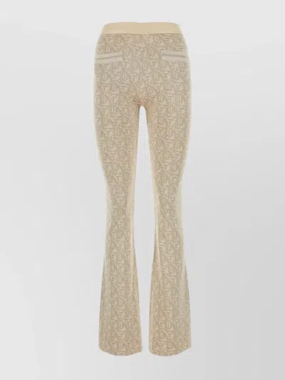PALM ANGELS MONOGRAMMED FLARED TROUSERS WITH RIBBED TEXTURE