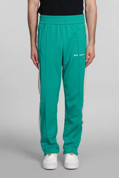 PALM ANGELS PANTS IN GREEN POLYESTER