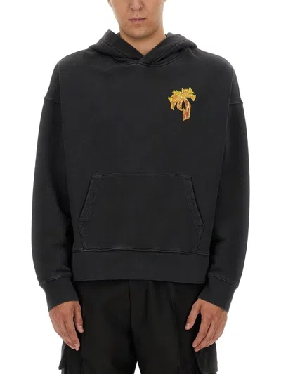 PALM ANGELS RELAXED FIT BLACK HOODIE WITH VIBRANT GRAPHIC DESIGN