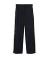 Palm Angels Side Stripe Detailed Pants In Black