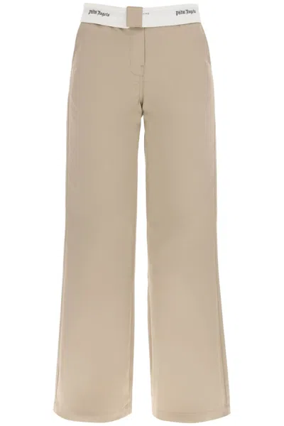 PALM ANGELS WOMEN'S REVERSED WAISTBAND CHINO PANTS IN BEIGE FOR SS23