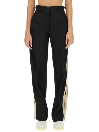 Palm Angels Wool-blend Palazzo Pants Logo Tape With Crochet Side Bands In Black