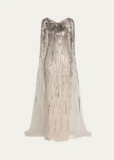 PAMELLA ROLAND SILVER SEQUINED GOWN WITH SHEER CAPE
