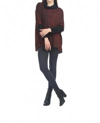Papillon Asymmetrical Stripe Poncho In Rust In Burgundy