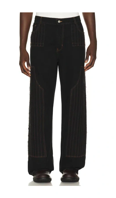 PAS UNE MARQUE DISTRESSED PATCH CARPENTER PANTS