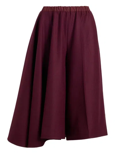 Patou Asymmetric Wool Shorts In Burgundy
