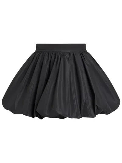 PATOU WOMEN BLACK SOLID BALLOON MINI SKIRT, 28 LUXURY SKIRTS FOR WOMEN DARVEYS