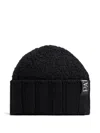 Patou Bouclé Ribbed Beanie Hat In Black