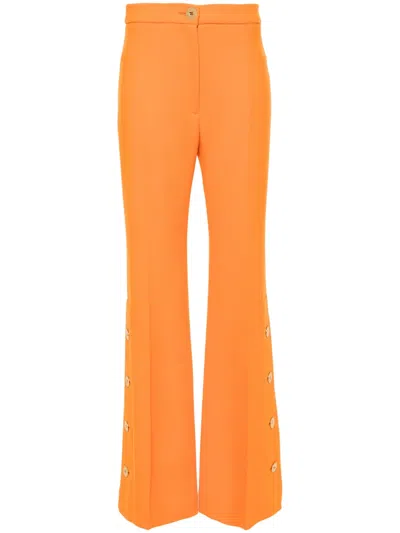 Patou Side-buttoned Tapered Trousers In Orange