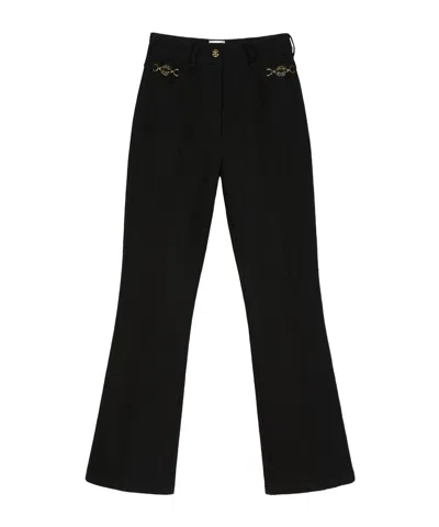Patou Flared Denim Trousers In Black