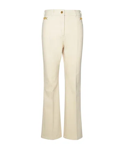 Patou Flared Denim Trousers In Neutral