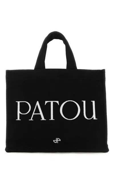 Patou Handbags. In Black