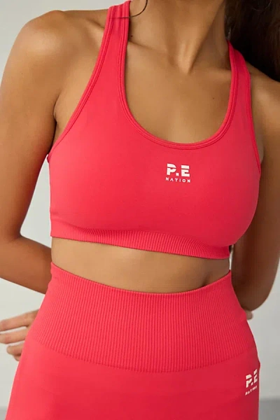 P.E NATION P. E NATION STRAWBERRY RESTORE SEAMLESS SPORTS BRA IN RED, WOMEN'S AT URBAN OUTFITTERS