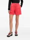 Peak Performance Elastic-waist Zip-pocket Shorts In Red