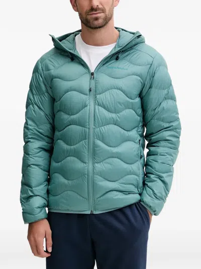 Peak Performance Helium Quilted Hooded Jacket In Blue