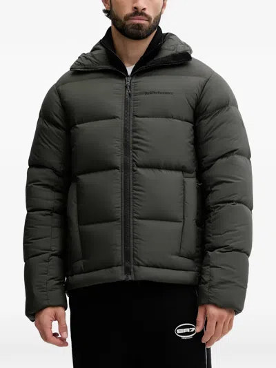 Peak Performance Rivel Hooded Quilted Jacket In Green