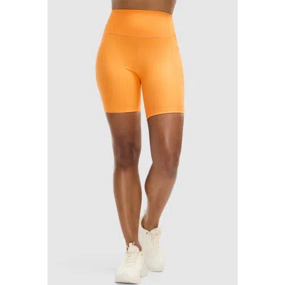 Peloton Cadent 7" High Rise Pocket Bike Short In Orange