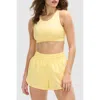 Peloton Cadent Mid Neck V Strap Bra In Pale Banana