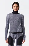 Perfect Moment Wavy Star Merino Wool Turtleneck Sweater In Black,white