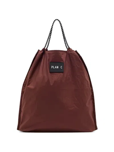 Plan C Drawstring Tote Bag In Brown