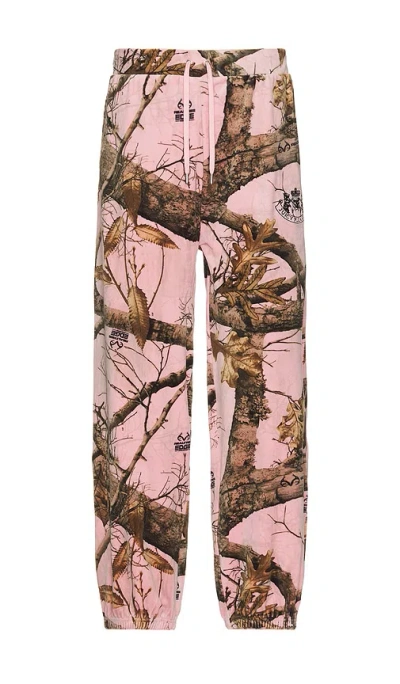 PLEASURES REALTREE VELOUR TRACK PANTS