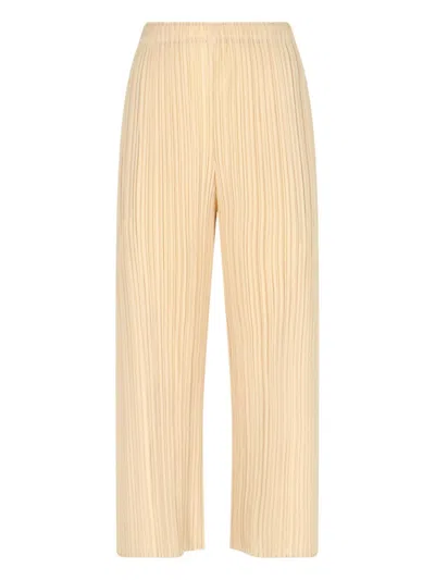 Pleats Please Bicolor Pleated High-waisted Trousers With Side Slits In Yellow