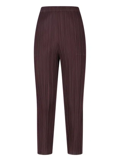 PLEATS PLEASE PLEATED BROWN TROUSERS WITH CROPPED CUT