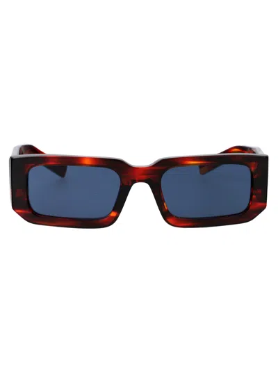 Prada 0pr 06ys Sunglasses In 17r06a Striped Radica