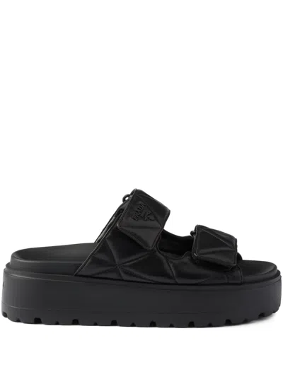 Prada Padded Nappa Leather Slides In Black