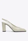 Prada 85 Patent Leather Slingback Pumps In Ivory