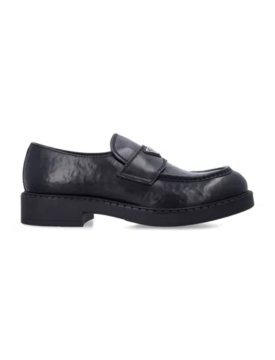 Prada Aged Leather Loafers With Elastic Gusset, Enameled Logo & Lightweight Rubber Sole In Nero