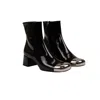 Prada Triangle Logo Plaque Boots In Black
