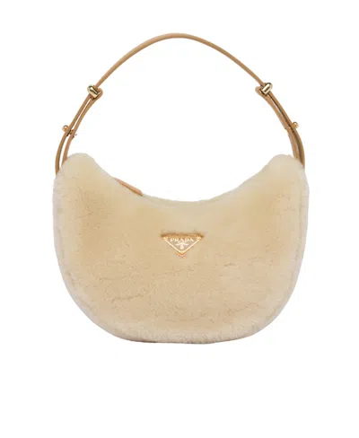Prada Arqué Shearling Shoulder Bag In Neutrals