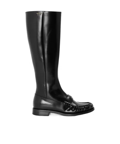 Prada Polished Leather Penny Knee-high Boots In Black