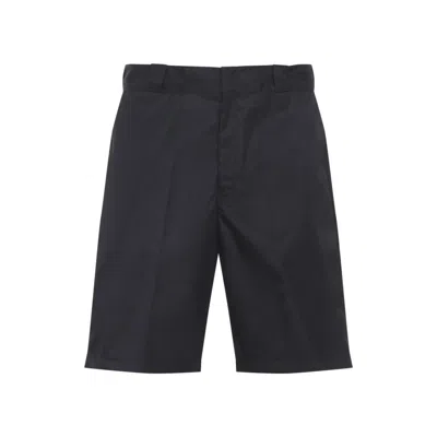 PRADA MEN BLACK LOGO BERMUDAS, 32 LUXURY PANTS FOR MEN DARVEYS