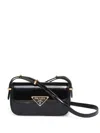 Prada Logo Plaque Patent Leather Shoulder Bag In Black